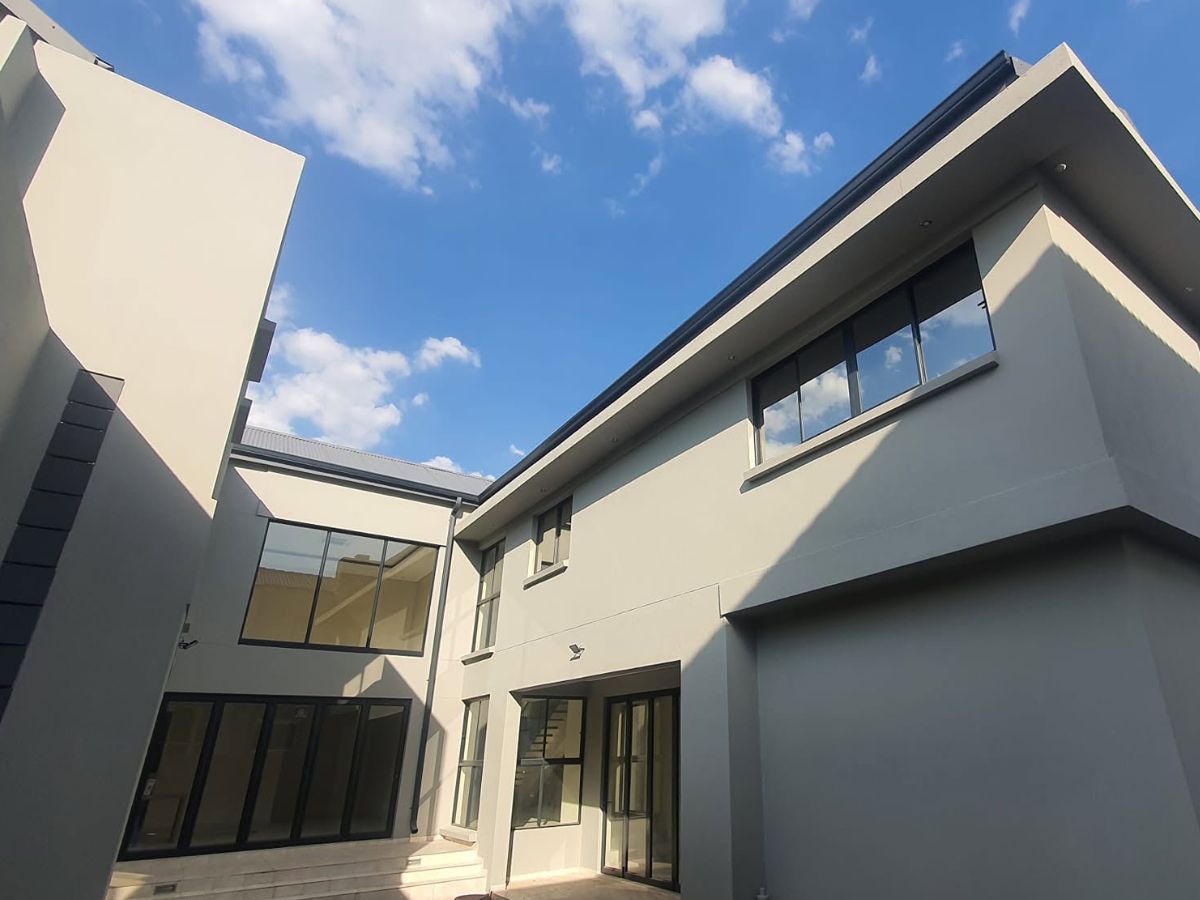 Bronze gutters with matching downpipes