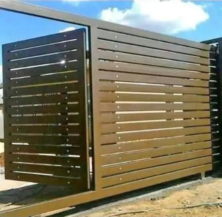 Slatted steel sliding gate finished in bronze
